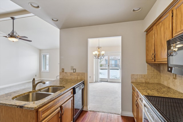 kitchen with sink, plenty of natural light, kitchen peninsula, and appliances with stainless steel finishes