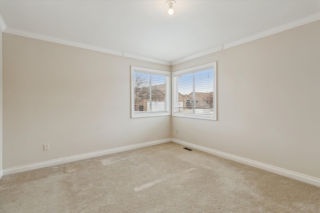 unfurnished room featuring light colored carpet and crown molding