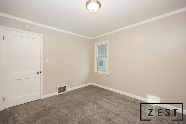 empty room with crown molding and carpet floors