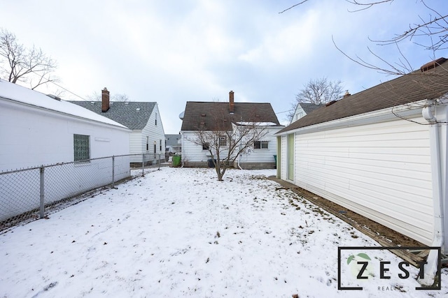 view of yard layered in snow