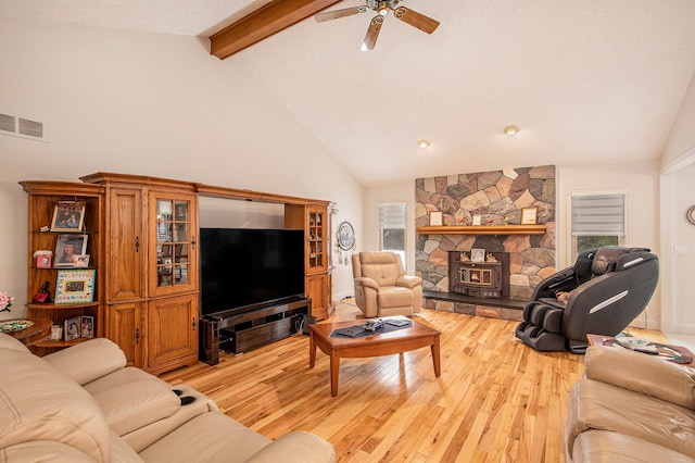 living room with high vaulted ceiling, light hardwood / wood-style flooring, beam ceiling, and ceiling fan