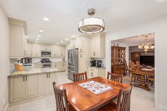 dining area with an inviting chandelier