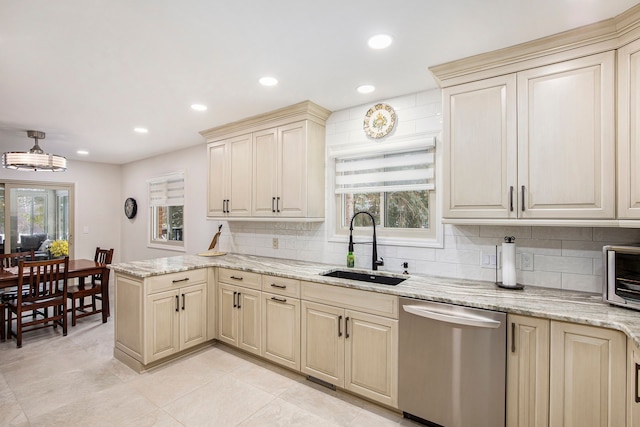 kitchen with sink, kitchen peninsula, dishwasher, and light stone counters