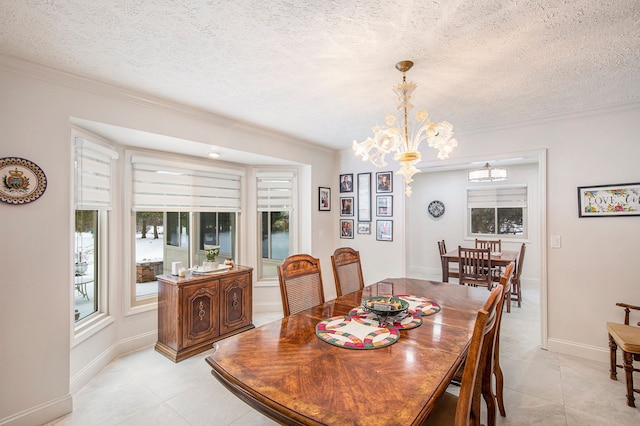 dining area featuring a textured ceiling, light tile patterned flooring, a chandelier, and crown molding