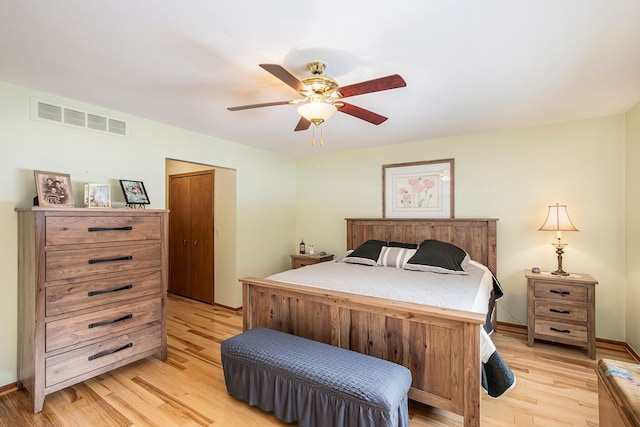 bedroom with light hardwood / wood-style flooring and ceiling fan