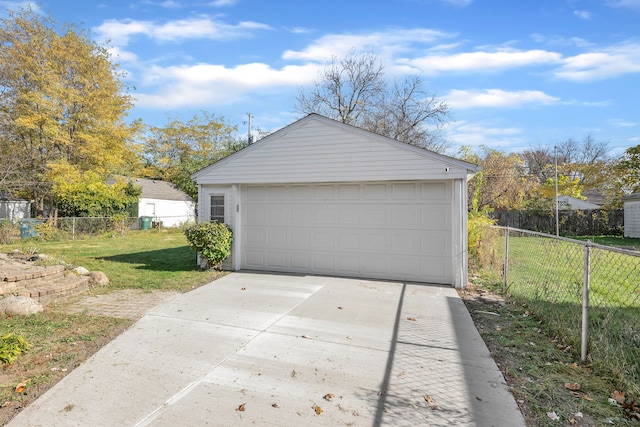 garage featuring a lawn