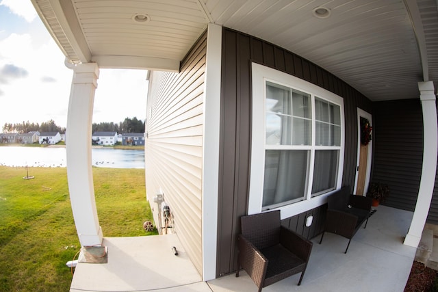 view of patio / terrace with a water view