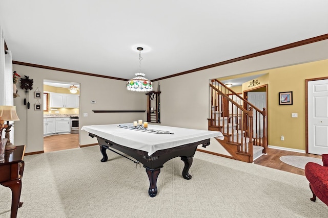 recreation room featuring ornamental molding and light colored carpet