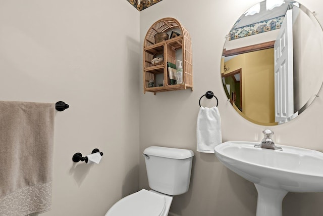 bathroom with toilet and sink