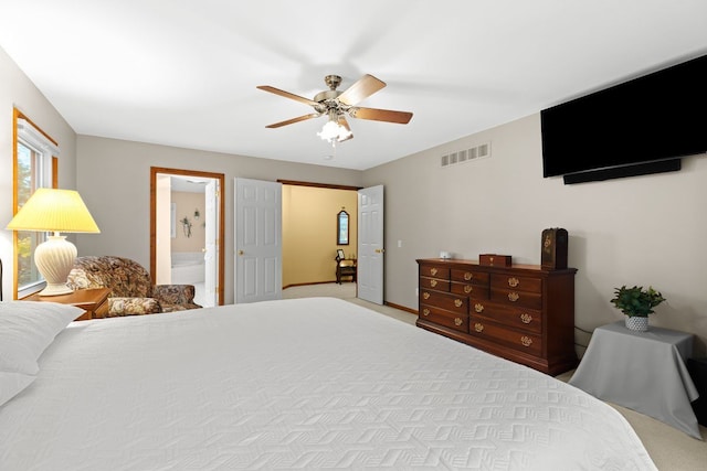 bedroom featuring connected bathroom and ceiling fan