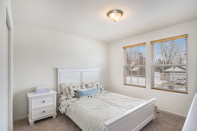 bedroom featuring light colored carpet