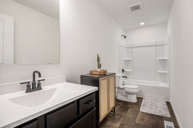 full bathroom with toilet, vanity, and shower / washtub combination