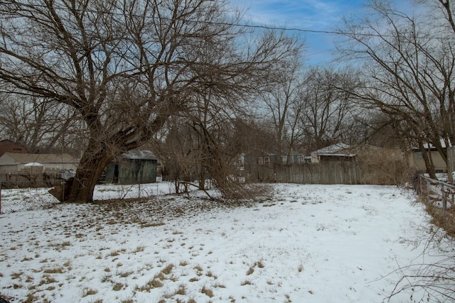 view of yard layered in snow