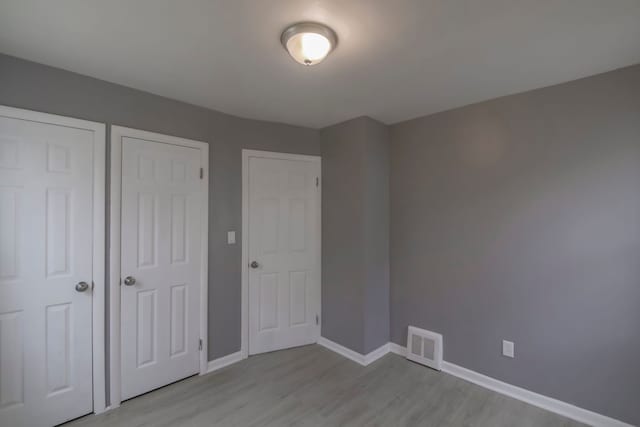 unfurnished bedroom featuring light hardwood / wood-style floors