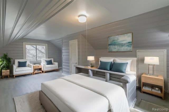 bedroom featuring hardwood / wood-style flooring and lofted ceiling