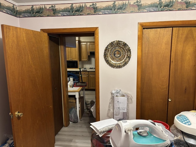 bathroom with decorative backsplash and hardwood / wood-style floors