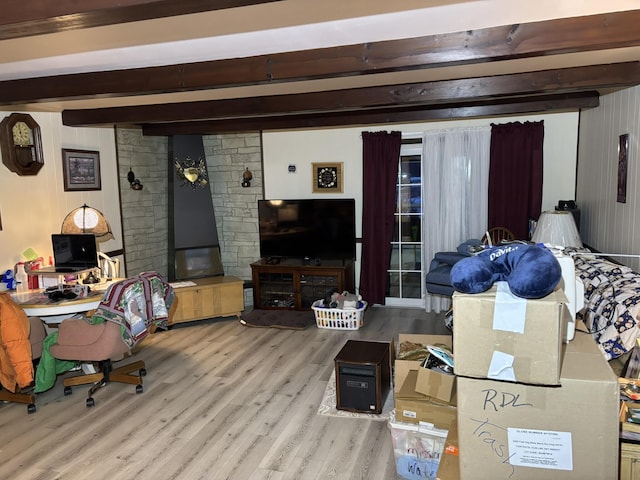 living room with light hardwood / wood-style floors and beam ceiling