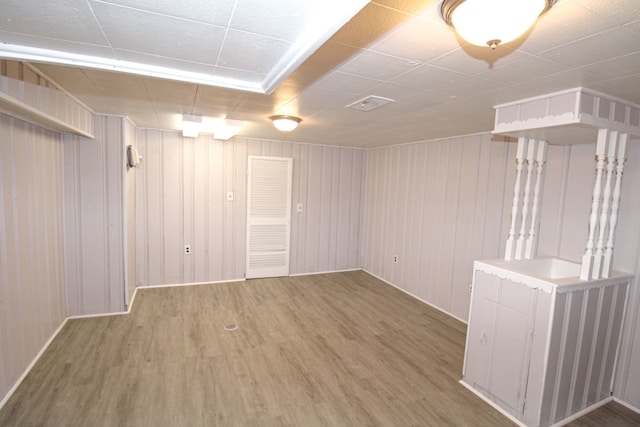 basement featuring hardwood / wood-style flooring