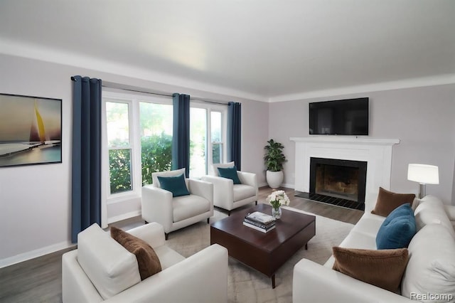 living room featuring plenty of natural light and hardwood / wood-style flooring