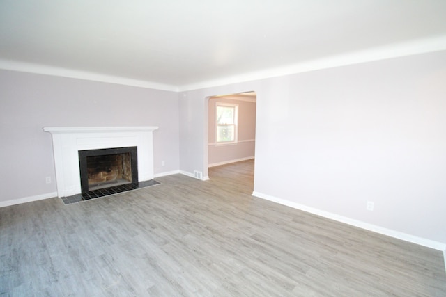 unfurnished living room featuring hardwood / wood-style flooring