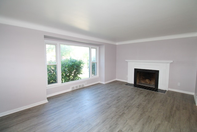 unfurnished living room with dark hardwood / wood-style floors