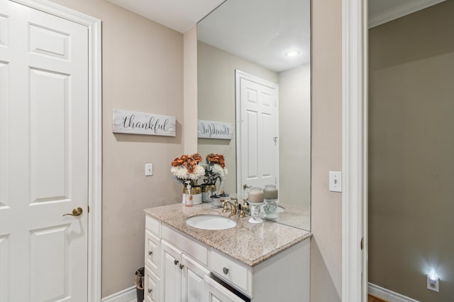 bathroom featuring vanity and crown molding