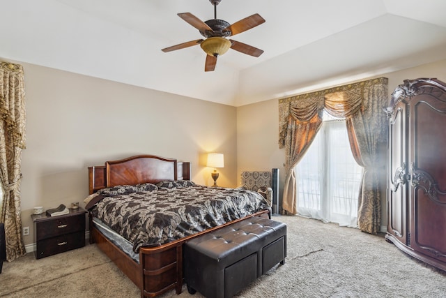 bedroom with lofted ceiling, light colored carpet, and ceiling fan