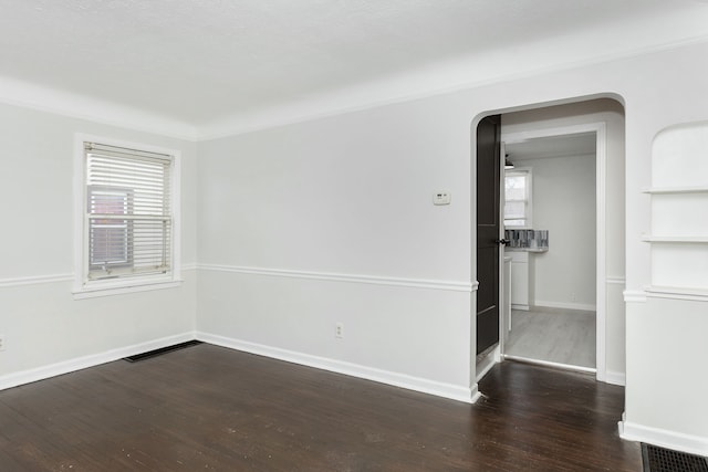 empty room featuring dark hardwood / wood-style floors