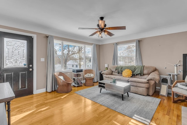 living room with hardwood / wood-style flooring and ceiling fan