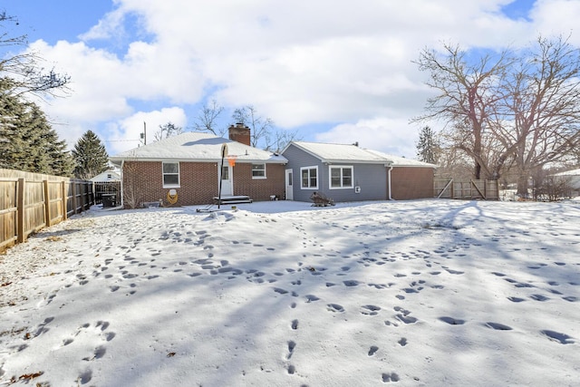 view of snow covered house