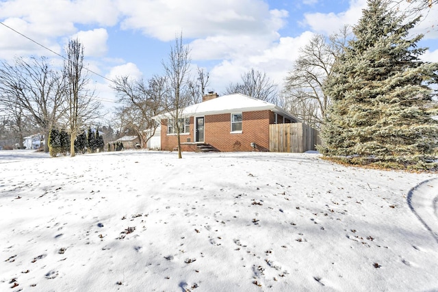 view of yard layered in snow