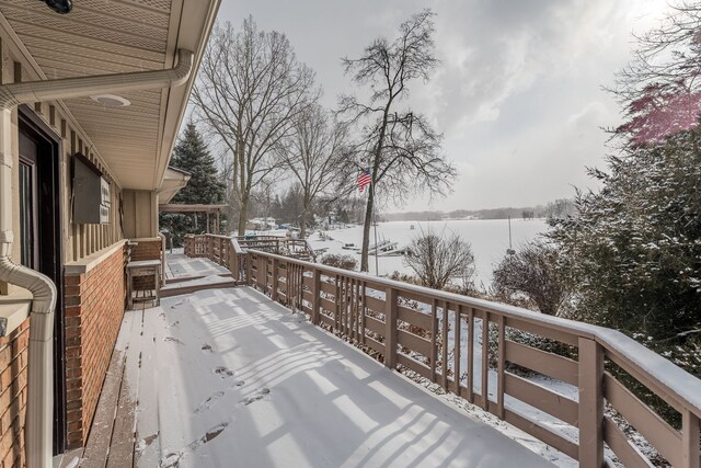 view of snow covered deck