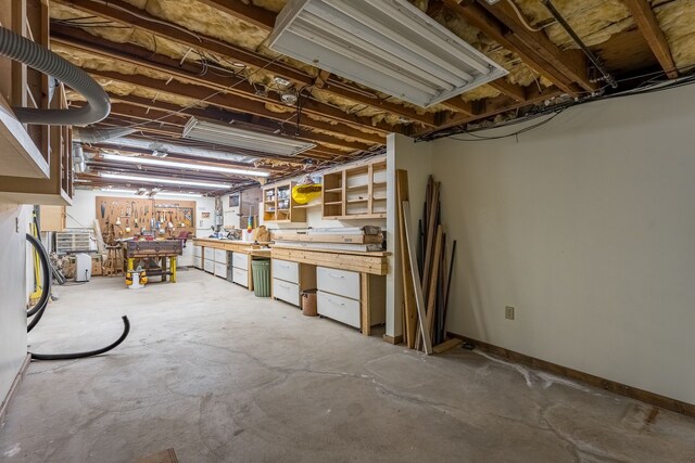 basement with a workshop area