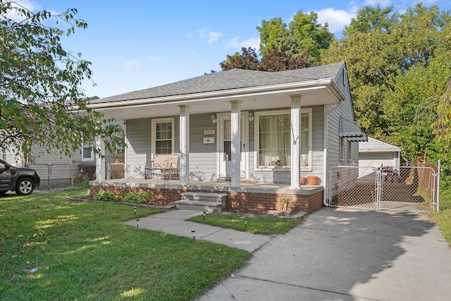 bungalow featuring a front yard and a porch