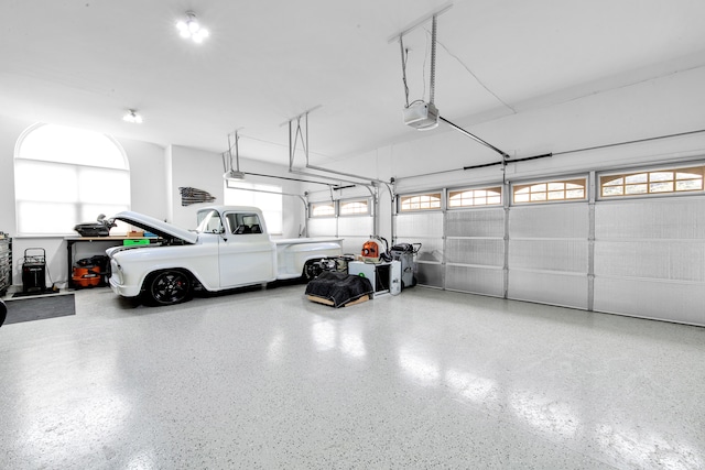 garage featuring a garage door opener