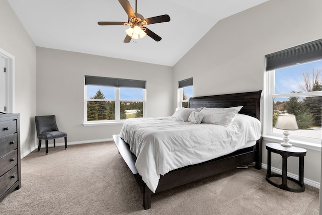 carpeted bedroom with lofted ceiling, baseboards, and a ceiling fan