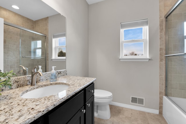 bathroom featuring visible vents, toilet, vanity, tile patterned flooring, and baseboards