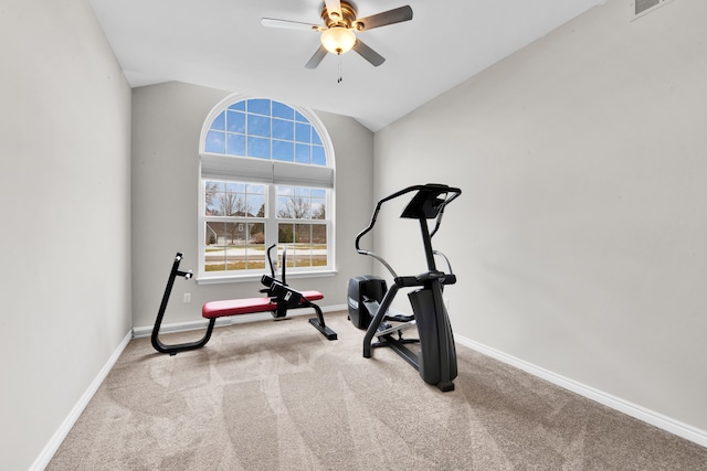 exercise room featuring ceiling fan, carpet floors, vaulted ceiling, and baseboards