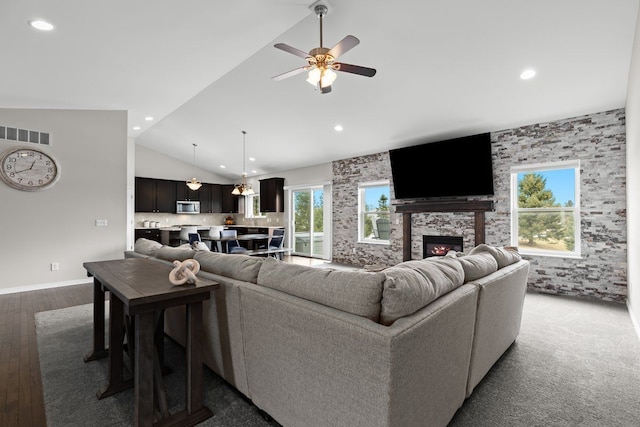 living room featuring recessed lighting, a fireplace, wood finished floors, a ceiling fan, and visible vents