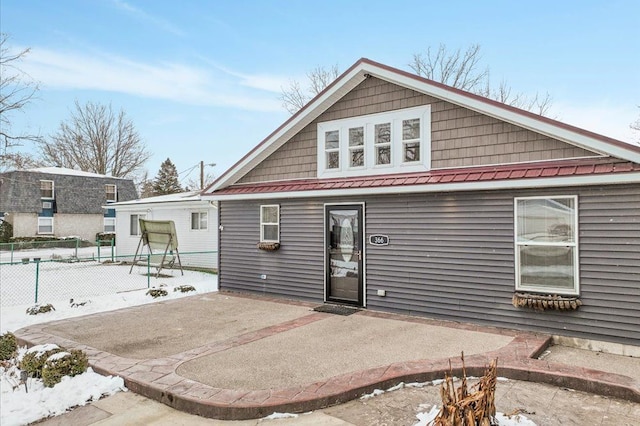 rear view of house with a patio