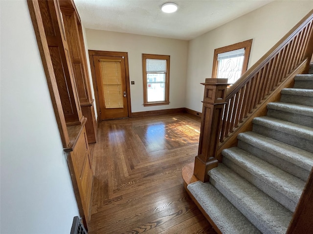 foyer entrance featuring dark hardwood / wood-style flooring