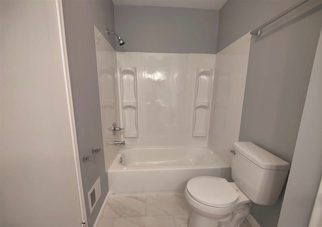 bathroom with toilet and  shower combination