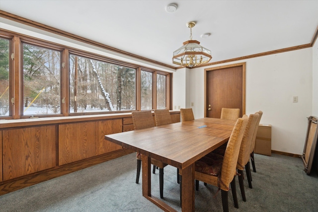 dining room with carpet, crown molding, and plenty of natural light