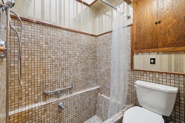 bathroom with toilet and walk in shower