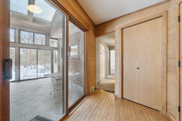 doorway with light hardwood / wood-style floors