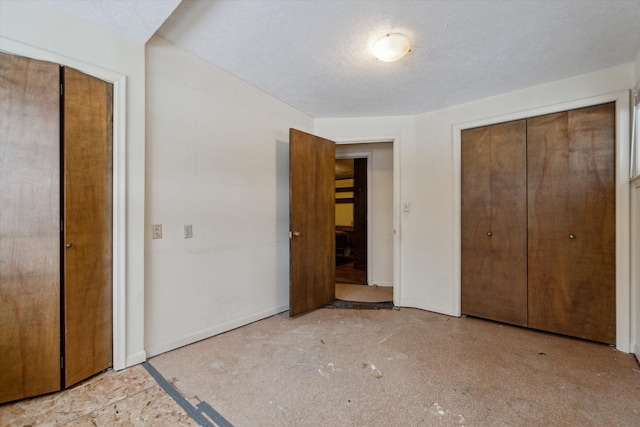 unfurnished bedroom with a textured ceiling