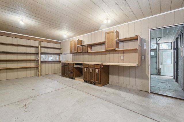 garage featuring wooden walls