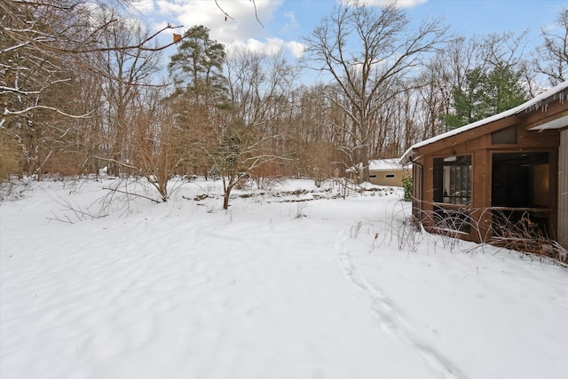 view of yard covered in snow