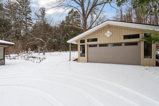 view of snow covered garage