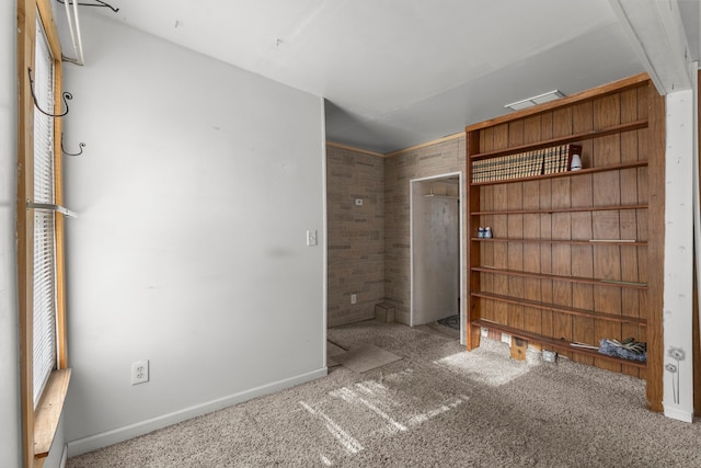 unfurnished bedroom featuring light carpet